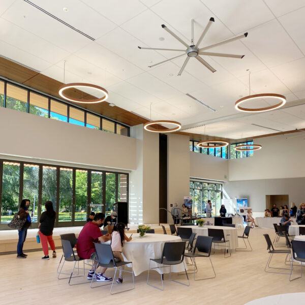 Visitors gather in spacious, daylit room during Burlingame Community Center grand opening event